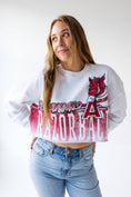 Load image into Gallery viewer, Woman wearing a white cropped sweatshirt with Arkansas Razorbacks logo and blue jeans on a white background, Arkansas Razorback cropped shirt, Arkansas Razorback boutique clothing, Arkansas sweatshirt