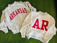 Load image into Gallery viewer, Two sweatshirts with 'ARKANSAS' and 'AR' printed in red on a green background, red Arkansas reversible sweatshirt, red Arkansas reversible mock neck, Arkansas reversible sweatshirt, Arkansas reversible mock neck, AR reversible sweatshirt, AR reversible mock neck, red AR reversible sweatshirt, red AR reversible mock neck, store near me, ARkansas reversible mock neck near me, Arkansas reversible sweatshirt near me