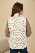 Load image into Gallery viewer, Person wearing a floral patterned vest over a brown shirt on a beige background, Floral vest, floral vest zara, floral vest top, floral vest puffer, floral vest women’s, vintage floral vest