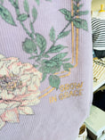 Load image into Gallery viewer, Purple garment with floral design and 'Grow in Grace' text on a mannequin.
