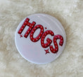 Load image into Gallery viewer, Circular gameday buttons with 'Hogs' text in a retro font, gameday buttons near me, gameday buttons sorority, gameday button pins, Arkansas buttons, art buttons, Fayetteville boutique store, shopping near me NWA mall, Arkansas gameday buttons, razorback store fayetteville