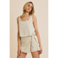 Load image into Gallery viewer, A female model wearing a beige square neck sleeveless top and a matching shorts with a bow detail.