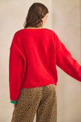 Load image into Gallery viewer, Woman wearing a red sweater and leopard print pants against a beige background, women’s christmas sweater, christmas sweater women, classy christmas sweater