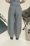 Load image into Gallery viewer, Person wearing blue striped pants with camping equipment in the background navy parachute pants, parachute pants 80s, parachute pants women, parachute pants h&m, parachute pants 90s, parachute pants near me, parachute pants my hammer, barrel pants, barrel leg pants, barrel jeans barrel pants trousers, barrel jeans women, barrel pants anthropology