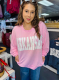 Load image into Gallery viewer, Woman wearing a pink 'ARKANSAS' ribbed sweatshirt in a clothing store Fayetteville ar. Pink ribbed arkansas sweatshirt, clothing stores Fayetteville ar