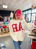 Load image into Gallery viewer, Person wearing a white sweatshirt with red AR letters in a Whimsy Whoo Boutique Store, Arkansas shirt, arkansans sweatshirt, razorback shirt, Razorback Sweatshirt, clothing stores Fayetteville ar