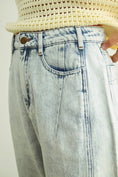 Load image into Gallery viewer, Light blue jeans with a beige knit top on a plain background