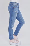 Load image into Gallery viewer, A pair of kids' straight leg jeans with a button fly, featuring Destruction details at the knee, and 5 functional pockets. The jeans are on a child model who is wearing pink sneakers.