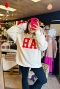 Load image into Gallery viewer, A mirror selfie of a model wearing the cream AR embroidered mock neck sweatshirt at Whimsy Store, a premier Arkansas Razorback store in Fayetteville AR.