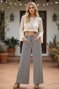 Load image into Gallery viewer, A full-length view of the black and white striped Picnic in the Park pants, a versatile summer staple from Whimsy Whoo in Fayetteville.