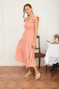 Load image into Gallery viewer, View the beautiful silhouette of our Peachy Keen Flutter Smocked Dress. Visit Whimsy Boutique, the best boutique near me in Fayetteville, for fully lined, high-quality spring dresses.