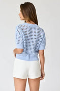 Load image into Gallery viewer, The back view of the Oh Hey Crochet! cropped sweater in Sky Blue, highlighting the ribbed hem and breathable airy knit