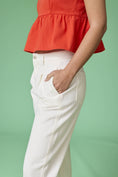 Load image into Gallery viewer, A side profile shot of the Executive Edge Barrel Pants highlighting the unique curved leg and structured twill fabric.