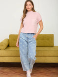 Load image into Gallery viewer, Model wearing old-school spring floral jeans from our Fayetteville store near you.