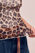 Load image into Gallery viewer, A close-up detail shot of the sheer leopard print mesh fabric on the Wild Side Mock Neck top, showcasing the trendy animal print texture.