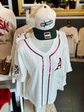 Load image into Gallery viewer, White Arkansas baseball jersey with red sequin trim and red “A” appliqué displayed on a mannequin in Whimsy Whoo Boutique in Fayetteville, AR with matching Omahogs baseball cap, perfect for ARkansas Razorback gameday.
