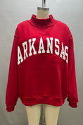Load image into Gallery viewer, Red sweatshirt with 'ARKANSAS ' printed on it displayed on a mannequin against a gray background. red Arkansas reversible sweatshirt, red Arkansas reversible mock neck, Arkansas reversible sweatshirt, Arkansas reversible mock neck, AR reversible sweatshirt, AR reversible mock neck,  red AR reversible sweatshirt, red AR reversible mock neck, store near me, ARkansas reversible mock neck near me, Arkansas reversible sweatshirt near me
