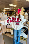 Load image into Gallery viewer, Woman wearing a white razorback sweatshirt with red Arkansas embroidery and hog logo, taking a mirror selfie in a Fayetteville ar boutique store. Arkansas sweatshirts for women near me, razorback sweatshirts for women nearby, Fayetteville  ar boutiques, razorback shopping online, arkansas razorback store, store near me, Fayetteville ar stores, arkansas razorback store
