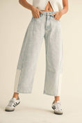 Load image into Gallery viewer, Woman wearing light blue barrel jeans from Whimsy Whoo boutique store in Fayetteville, AR
