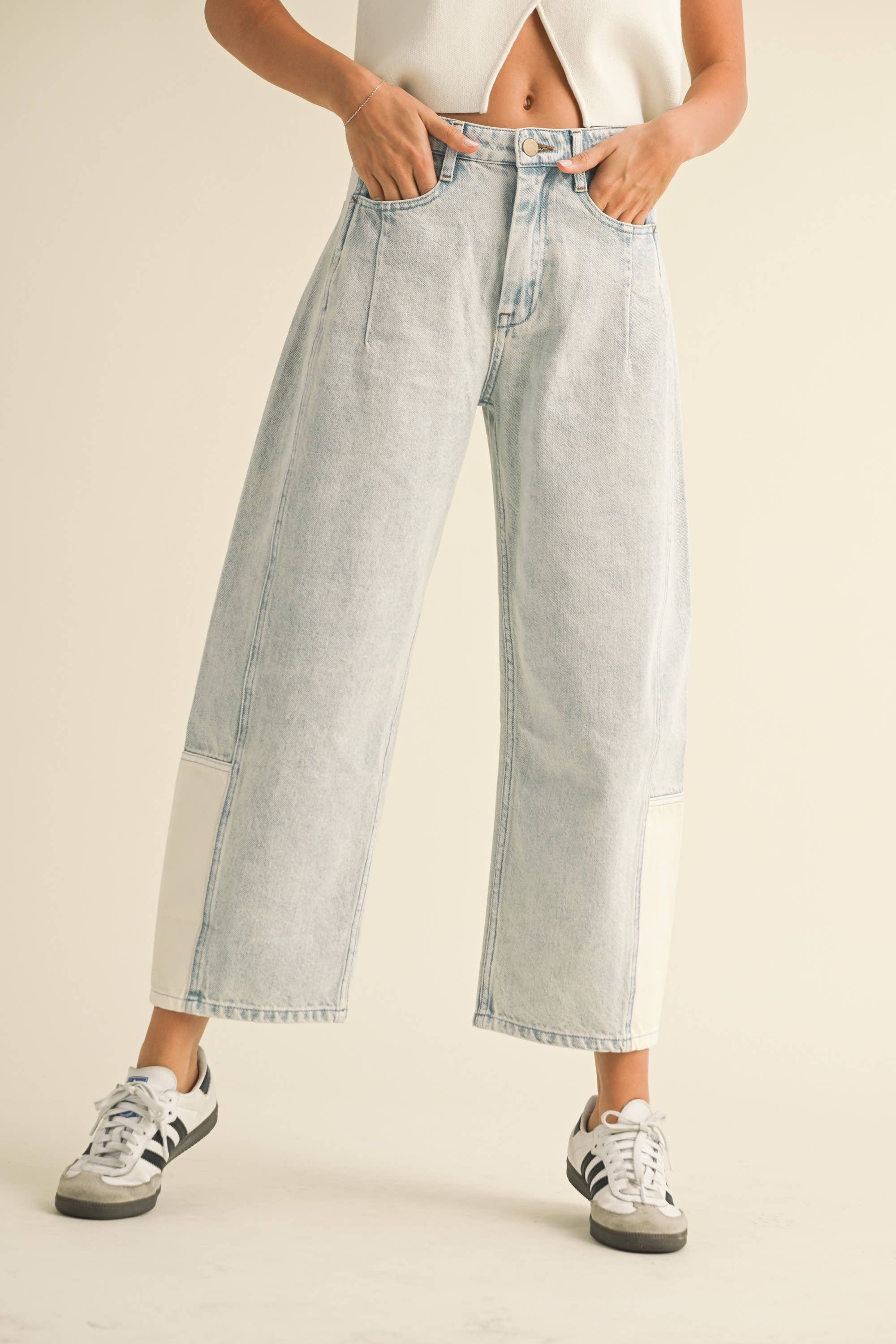 Woman wearing light blue barrel jeans from Whimsy Whoo boutique store in Fayetteville, AR