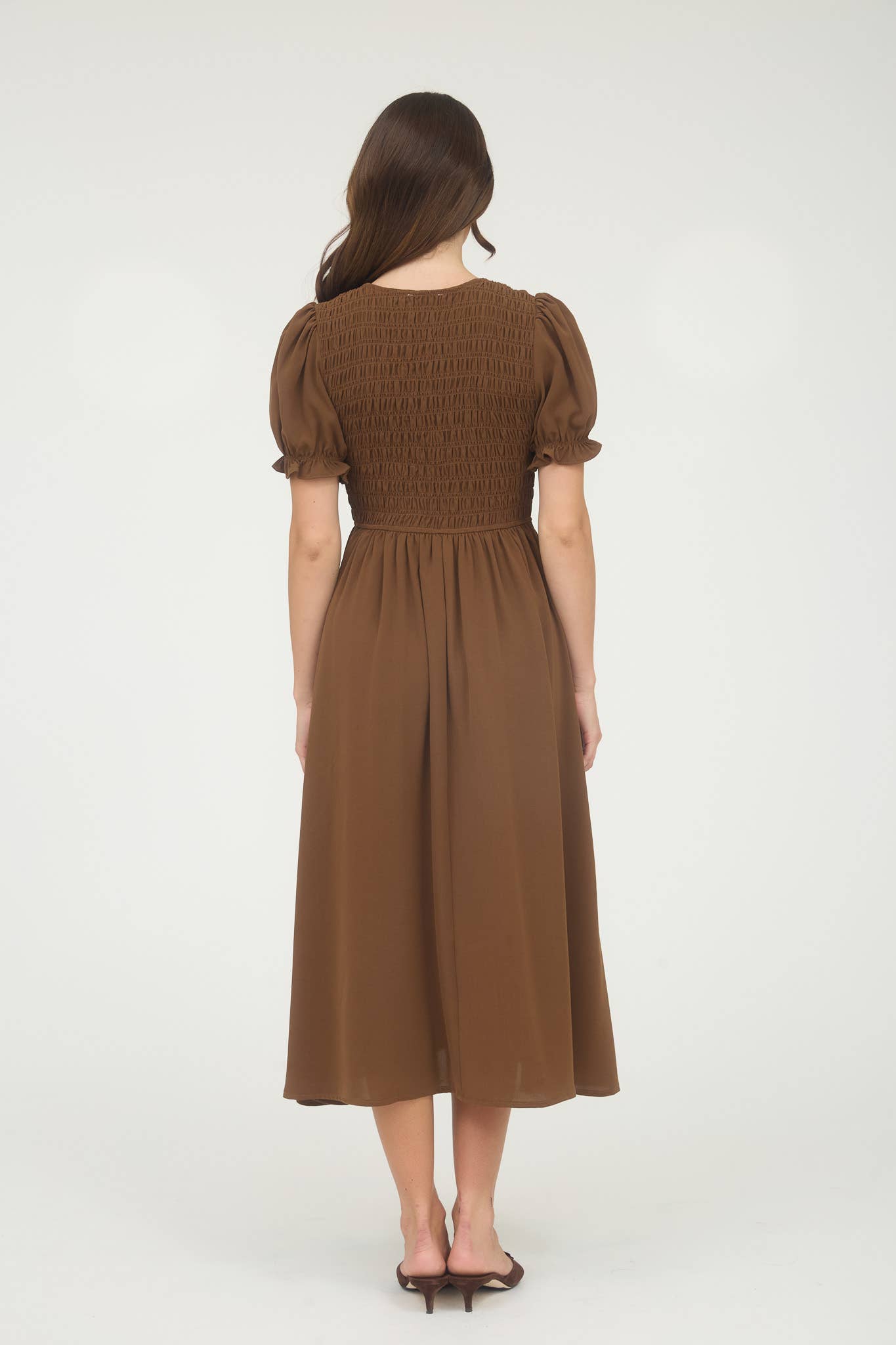 Woman wearing a brown dress on a white background, blu pepper clothing, blu pepper dress, brown dress, brown maxi dress, brown midi dress, autumn dresses for women, fall dresses for women