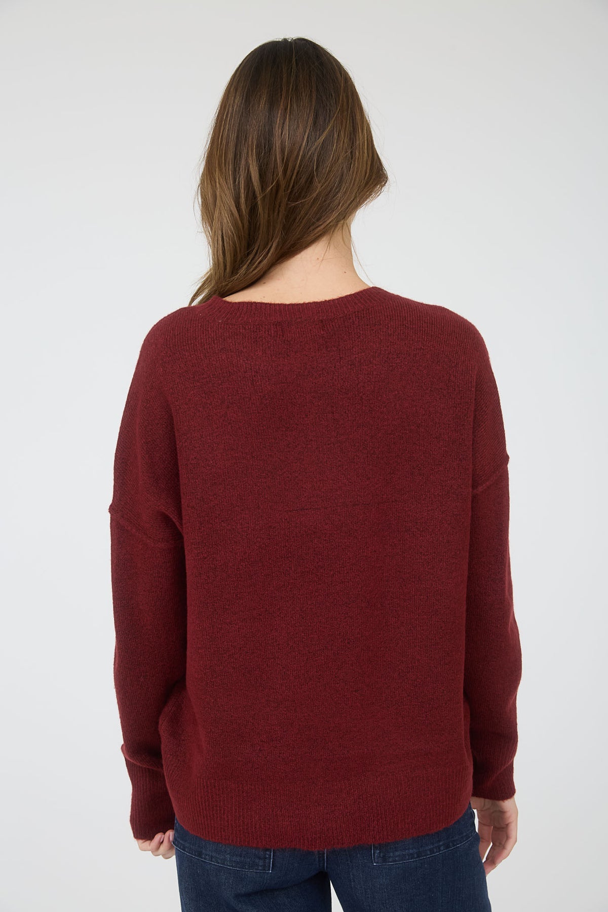 Person wearing a burgundy sweater on a white background,  maroon sweater, soft burgundy sweater,  red top, blu pepper top, blu pepper sweater, shopping near me, Fayetteville ar boutique store