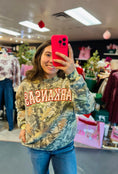 Load image into Gallery viewer, Woman wearing a camouflage Arkansas sweatshirt in Whimsy Whoo Boutique in their Arkansas Razorback Store.  Camo Arkansas sweatshirt for women, camo Arkansas shirt, camo arkansas razorback shirt, camo arkansas razorback sweatshirt, camo arkansas crewneck, arkansas razorback store, women Arkansas sweatshirts 
