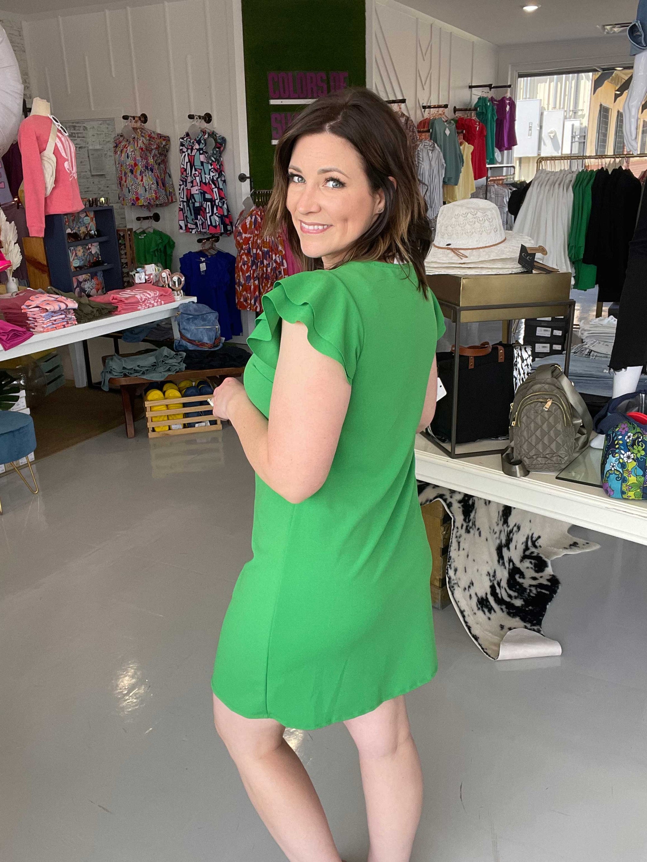 The Essential Tunic Dress, color Kelly Green. Flutter sleeves, midi length. back view