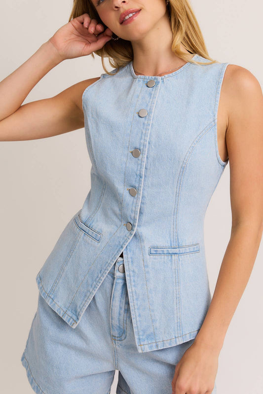 Light blue denim vest worn by a model on a plain background, denim top for women, denim sleeveless top, denim vest for women, denim sleeveless vest, clothing stores near me