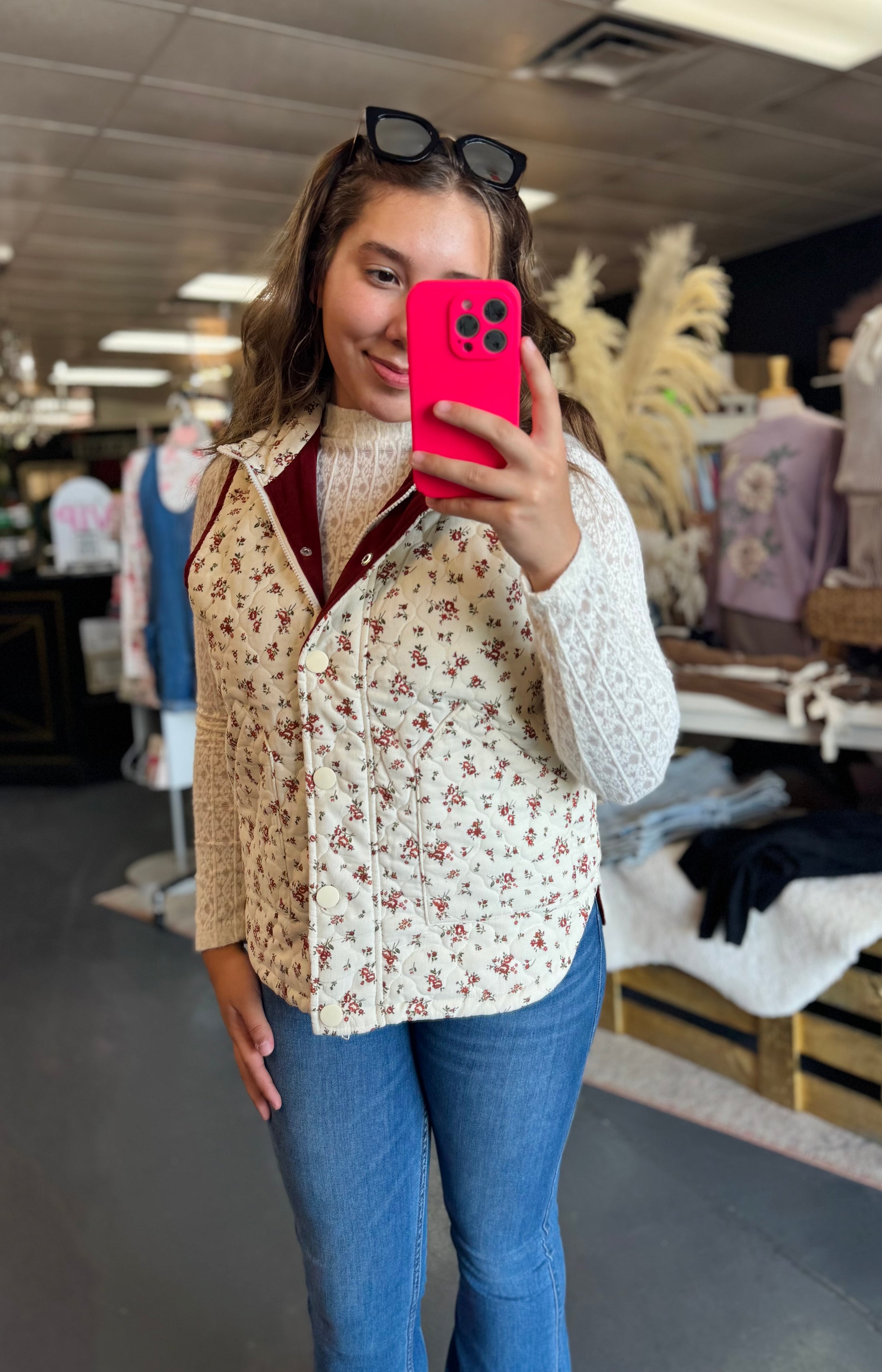 Woman wearing a floral vest for fall in a stores in fayetteville, ar fall floral vest, floral vests for women, floral vest top, floral vest outfit, shopping near me the Fayetteville Mall