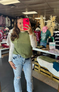 Load image into Gallery viewer, Women taking a mirror selfie in a clothing store with a green sweater and ripped jeans. Green sweater, green short sleeve sweater, blu pepper sweater, boutiques near me, boutiques Fayetteville ar

