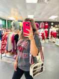 Load image into Gallery viewer, Woman taking a mirror selfie in a razorback clothing store wearing a gray 'arkansas' shirt and holding a pink phone.  grey Arkansas razorback tee, Arkansas razorback shirts, arkansas razorback boutique clothing, arkansas razorback shirts, razorback store, razorback apparel Fayetteville ar,  arkansas razorback store

