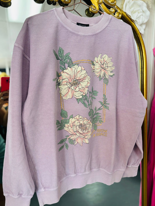 Light purple sweatshirt with floral design on a hanger, purple ribbed sweatshirt, christian sweatshirt, christian graphic tee, christian graphic sweatshirt, Fayetteville boutiques, shopping near me