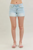 Load image into Gallery viewer, Light blue denim shorts worn by a person on a plain background, Judy blue shorts, clothing stores near me
