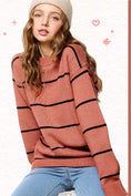 Load image into Gallery viewer, Person wearing a red sweater with black stripes and a beige beanie on a white background, sweater, sweaters for women, sweater nearby, oversized sweaters
