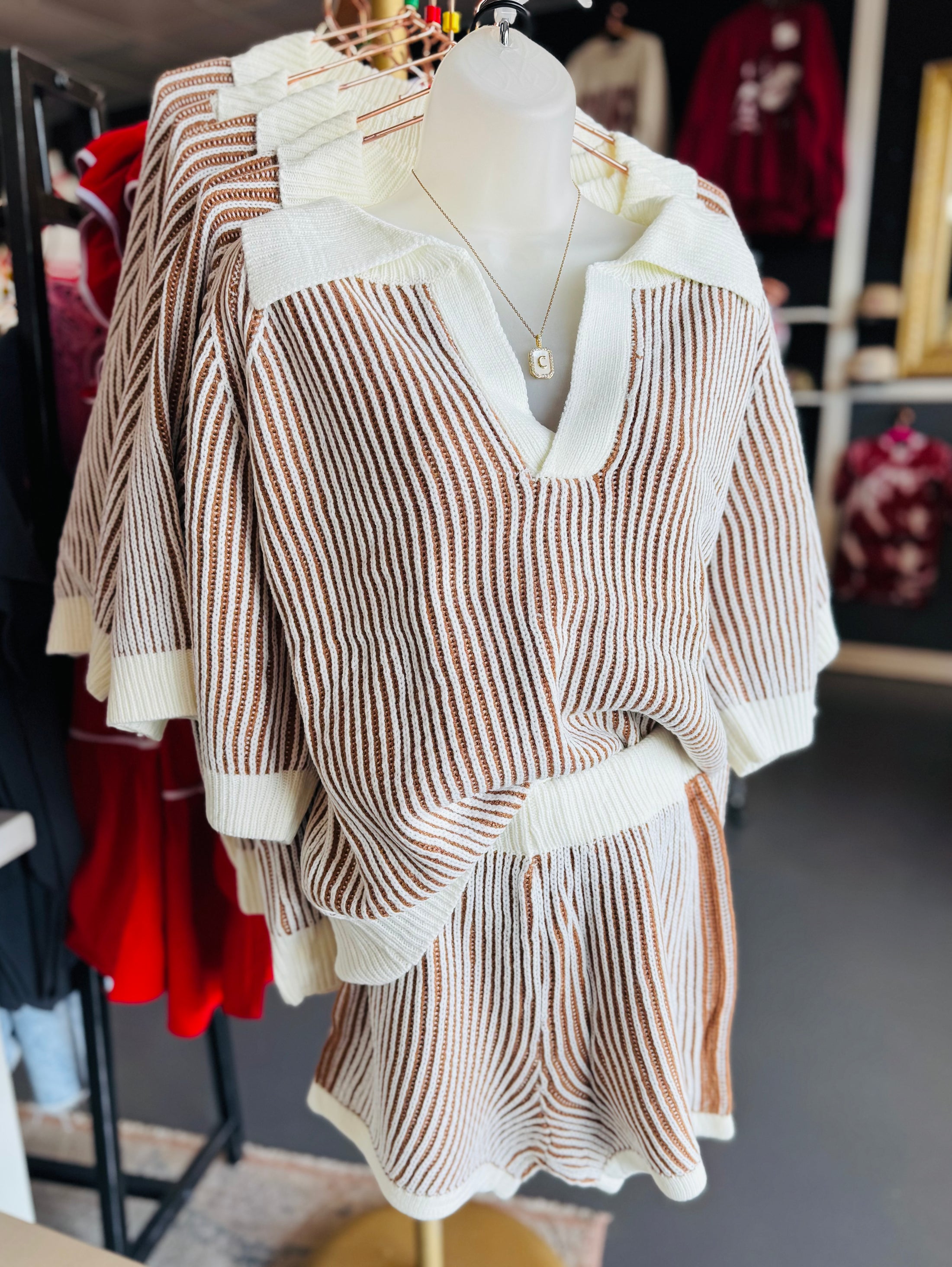 Striped blouse and skirt set on a mannequin in a store setting,  Bibi matching outfit,  sweater matching set for women, fall matching set for women, Fayetteville ar clothing store