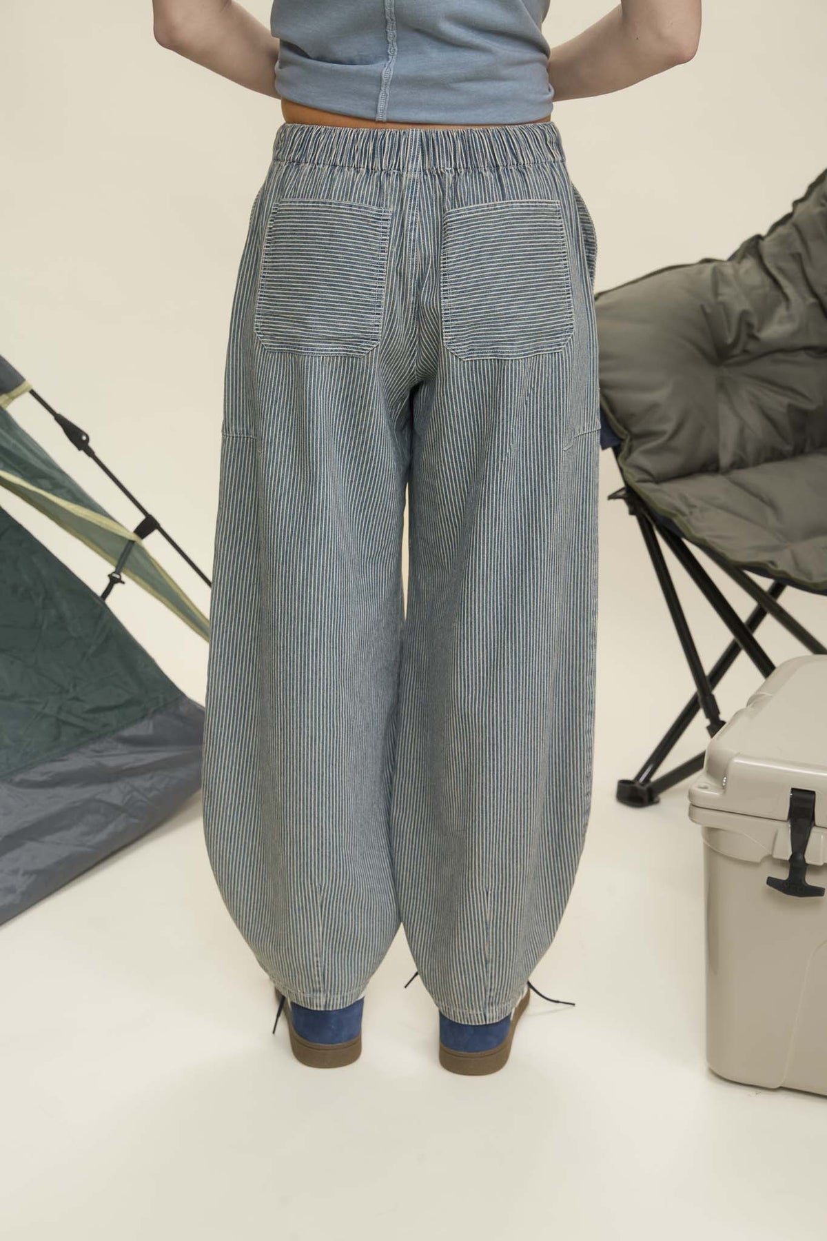Person wearing blue striped pants with camping equipment in the background navy parachute pants, parachute pants 80s, parachute pants women, parachute pants h&m, parachute pants 90s, parachute pants near me, parachute pants my hammer, barrel pants, barrel leg pants, barrel jeans barrel pants trousers, barrel jeans women, barrel pants anthropology