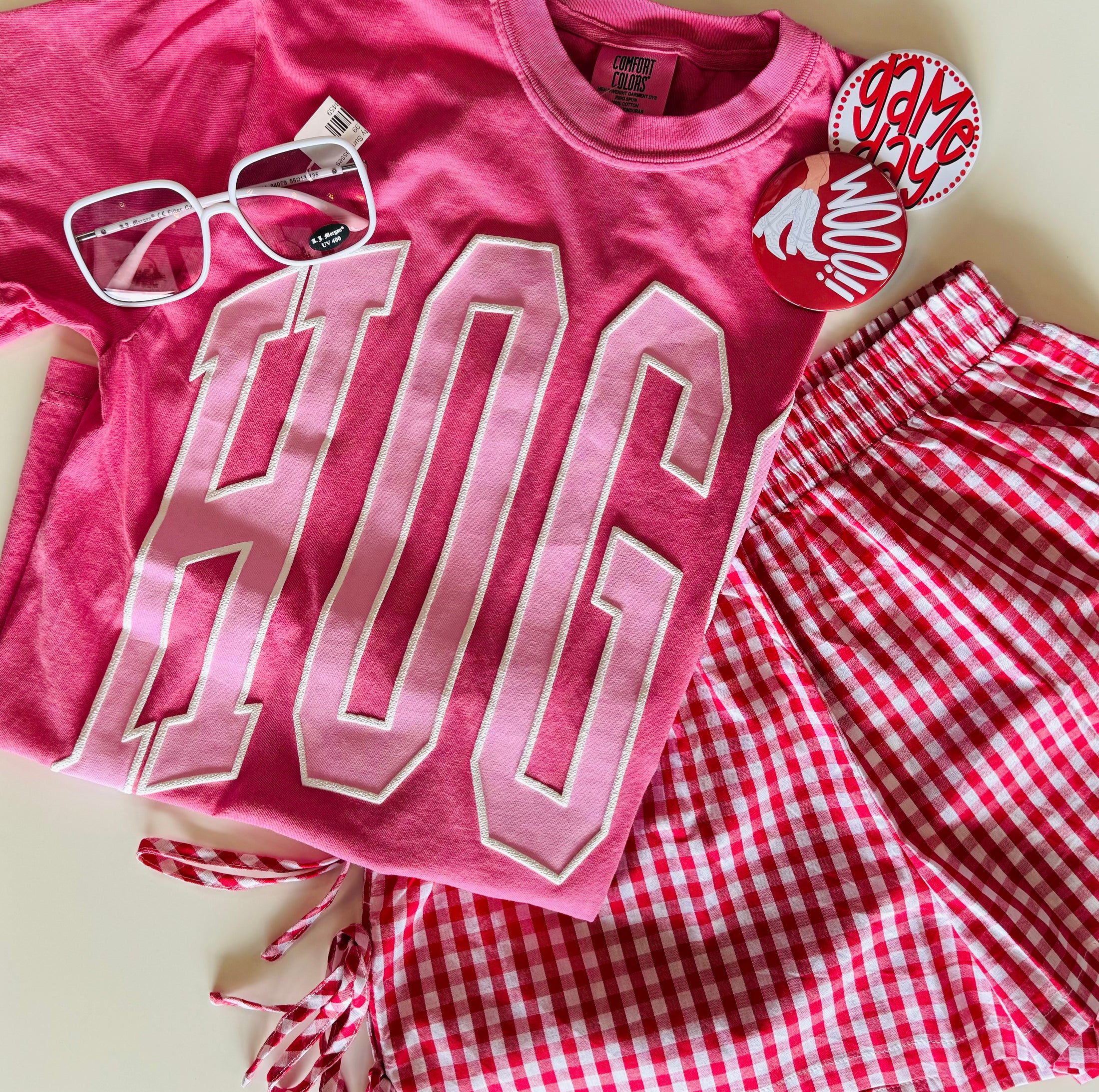 Pink t-shirt with 'HOG' and red checkered shorts on a light background, Pink hogs shirt, pink razorback shirt, women’s razorback shirt, women’s hogs shirt, razorback shirt for women, hogs shirt for women, razorback top for women, hogs top for women