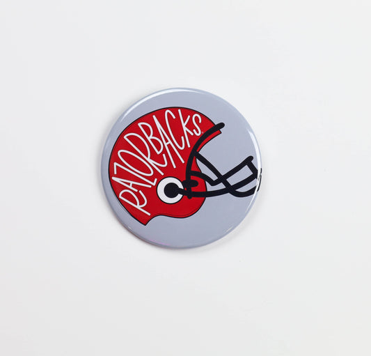 Button badge with 'Razorbacks' text and helmet design on a white background, razorback football helmet gameday pin, razorback football helmet gameday button, razorback gameday pin, razorback gameday button, razorback pin, razorback button, Arkansas pin, Arkansas button