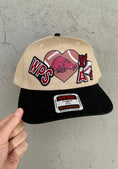 Load image into Gallery viewer, Beige and black Arkansas razorbackcap with razorback football patches designs and text on a gray background. Razorback hats near me, razorback trucker hat, women razorback trucker hat, razorback boutique clothing
