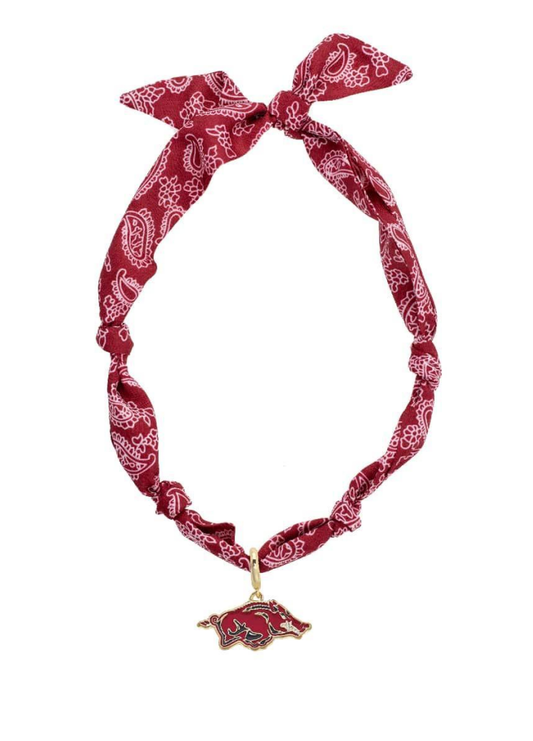 Red bandana with white patterns and a gold charm on a white background, razorback necklace, gold razorback necklace, Arkansas razorback necklace, razorback jewelry, Arkansas razorback jewelry, razorback bandana