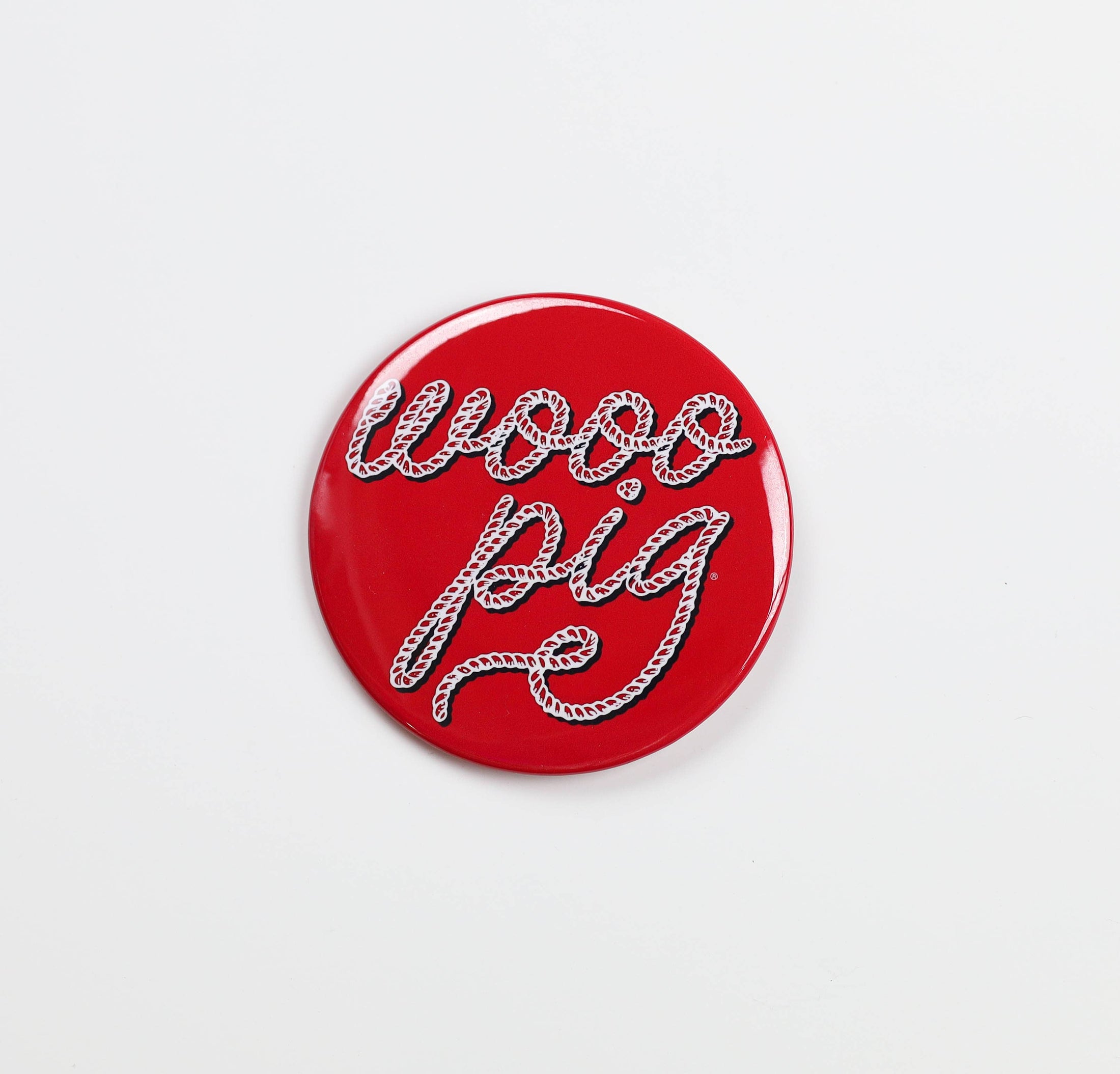 Red button with 'wooo pig' text on a white background, razorback gameday button, razorback gameday pin, red gameday pin, red gameday button, Arkansas gameday pin, Arkansas gameday buttons, razroback stores in Fayetteville ar
