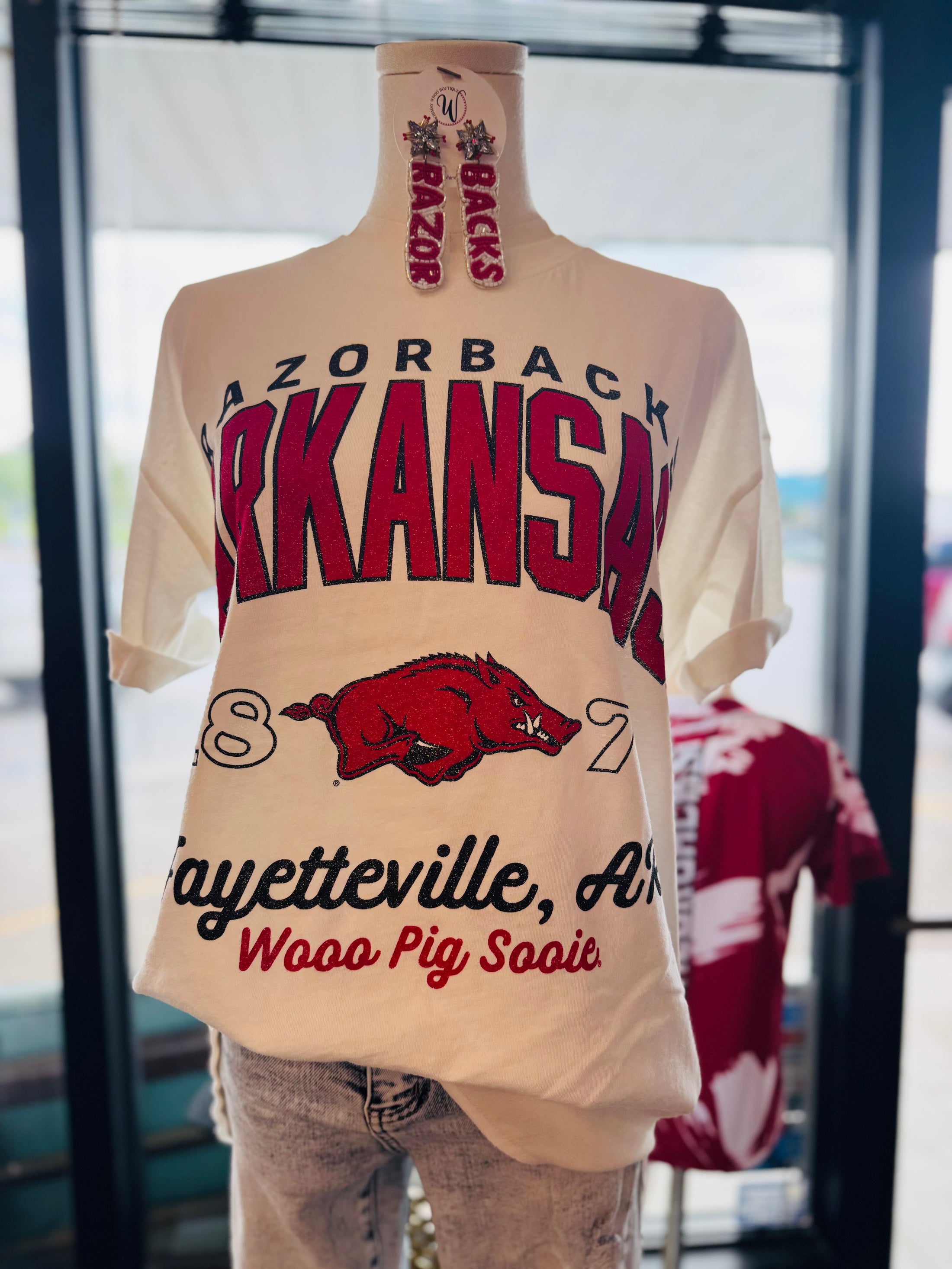Mannequin wearing a white razorback tshirt, razorback store near me, razorback store Fayetteville, AR, white Razorback tshirt for women, women’s razorback tees, AR Razorback apparel
