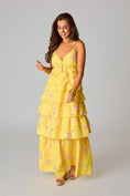 Load image into Gallery viewer, Woman wearing a yellow floral dress from Whimsy Whoo boutique store in Fayetteville, AR.
