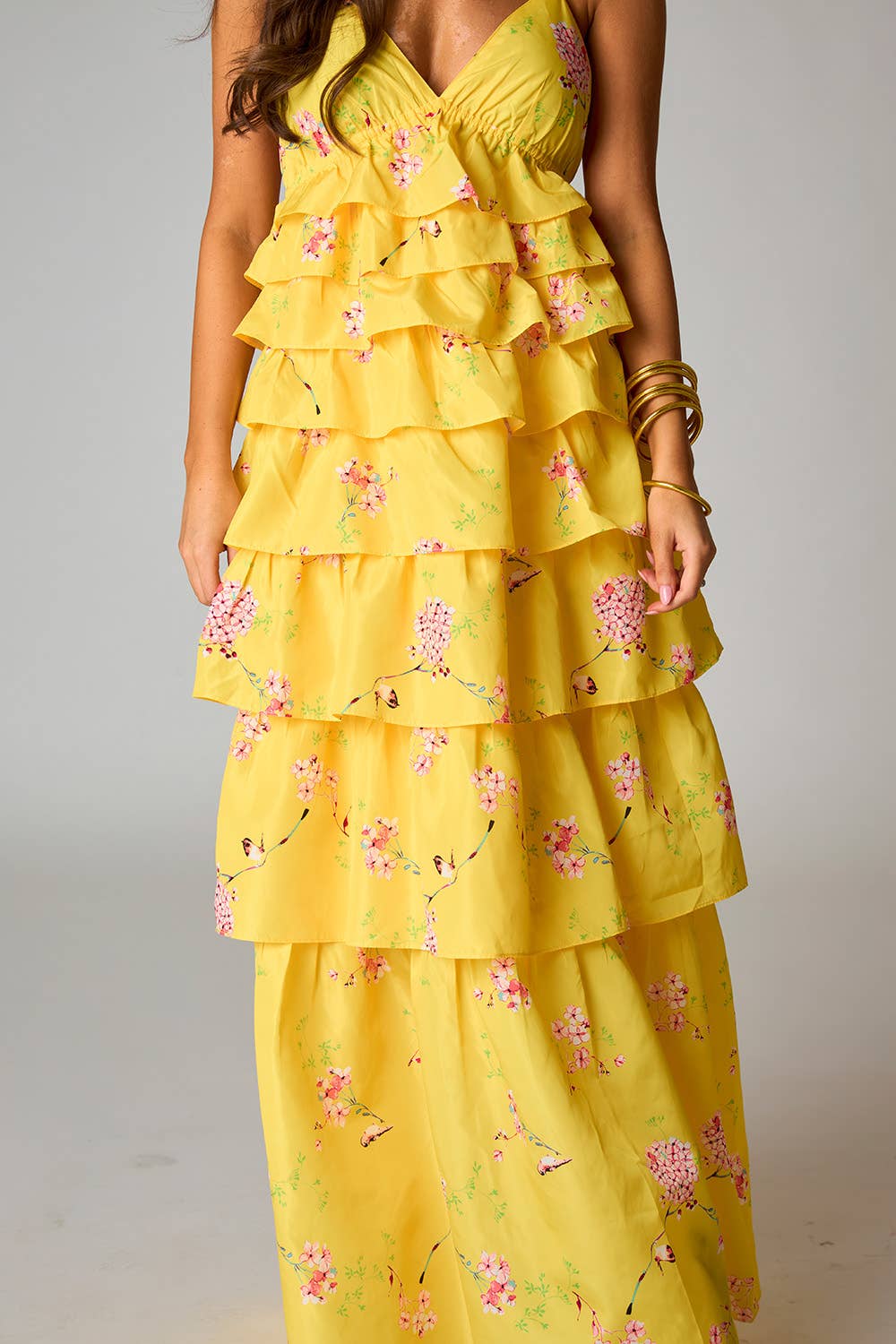 Yellow floral dress with ruffled layers from Whimsy Whoo boutique store in Fayetteville, ar