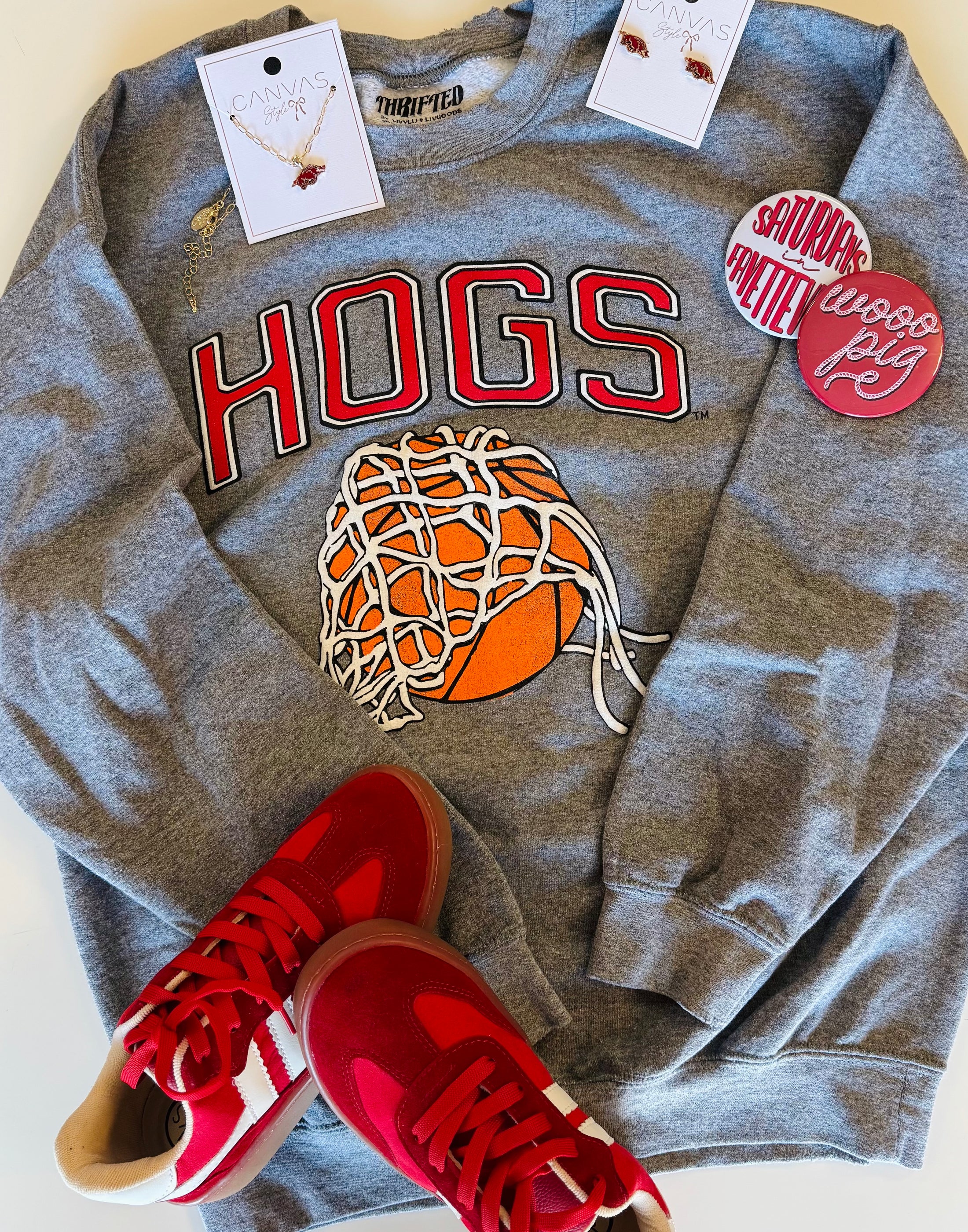 A styled gameday flat lay featuring the Hogs Basketball sweatshirt, denim shorts, red sneakers, and "Woo Pig" accessories from Whimsy Whoo Boutique.