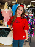 Load image into Gallery viewer, Close-up of Big Red Arkansas Razorback graphic on oversized crimson tee, women’s University of Arkansas apparel for football season and game day.
