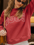 Load image into Gallery viewer, Close up of the Chic Spot Hogs Polka Dot Arkansas Sweatshirt in crimson with white dotted varsity lettering.
