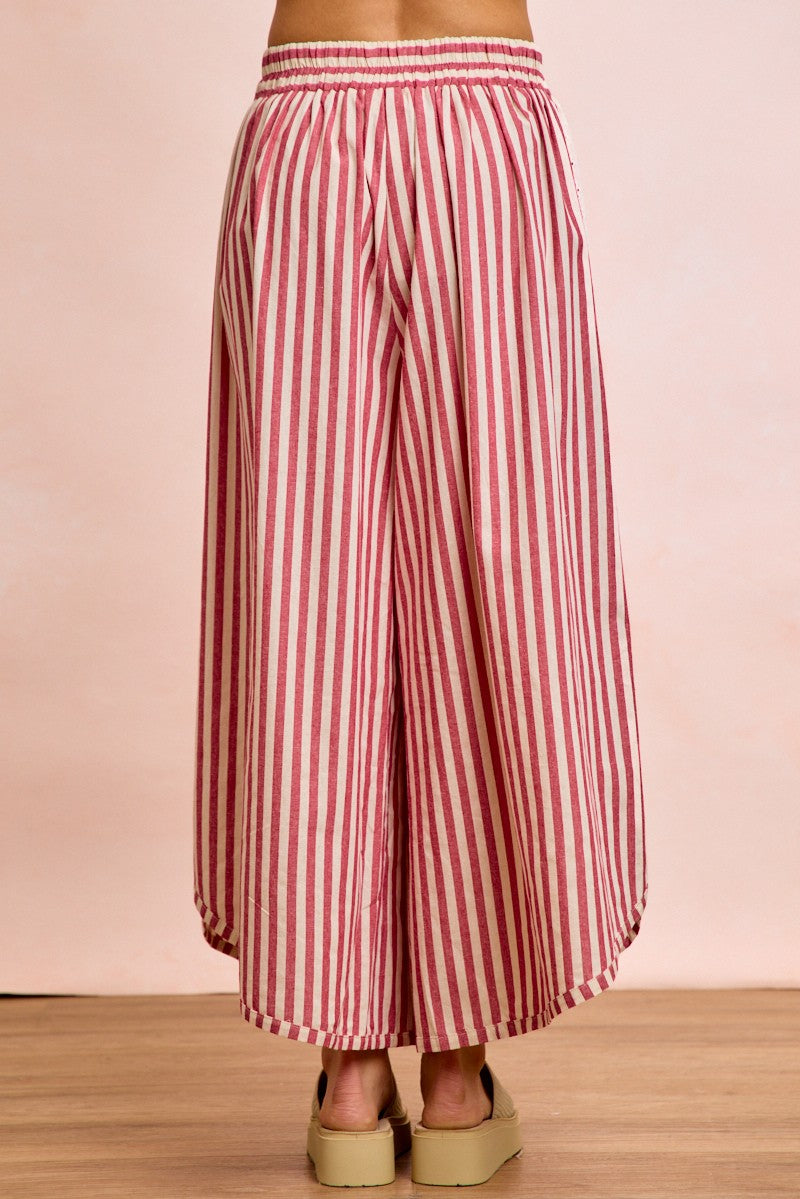 Back view of the red and white Free Spirit Striped Barrel Pants showing the effortless drape and tapered ankle.