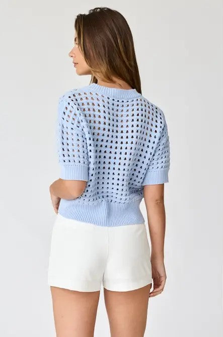 The back view of the Oh Hey Crochet! cropped sweater in Sky Blue, highlighting the ribbed hem and breathable airy knit
